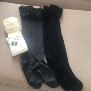 Over the knee boot socks. Never worn. 3 pairs
